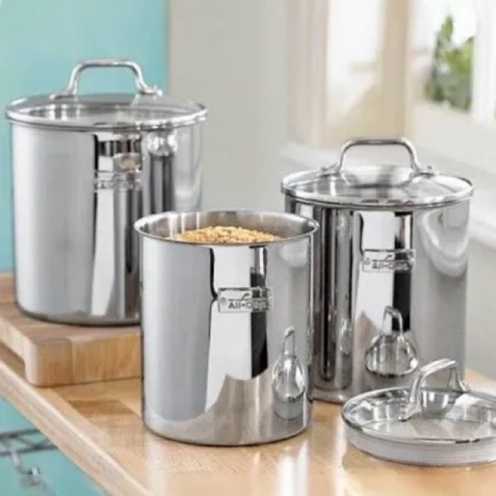 All-Clad three piece canister set. Air tight glass lids. Pristine set .